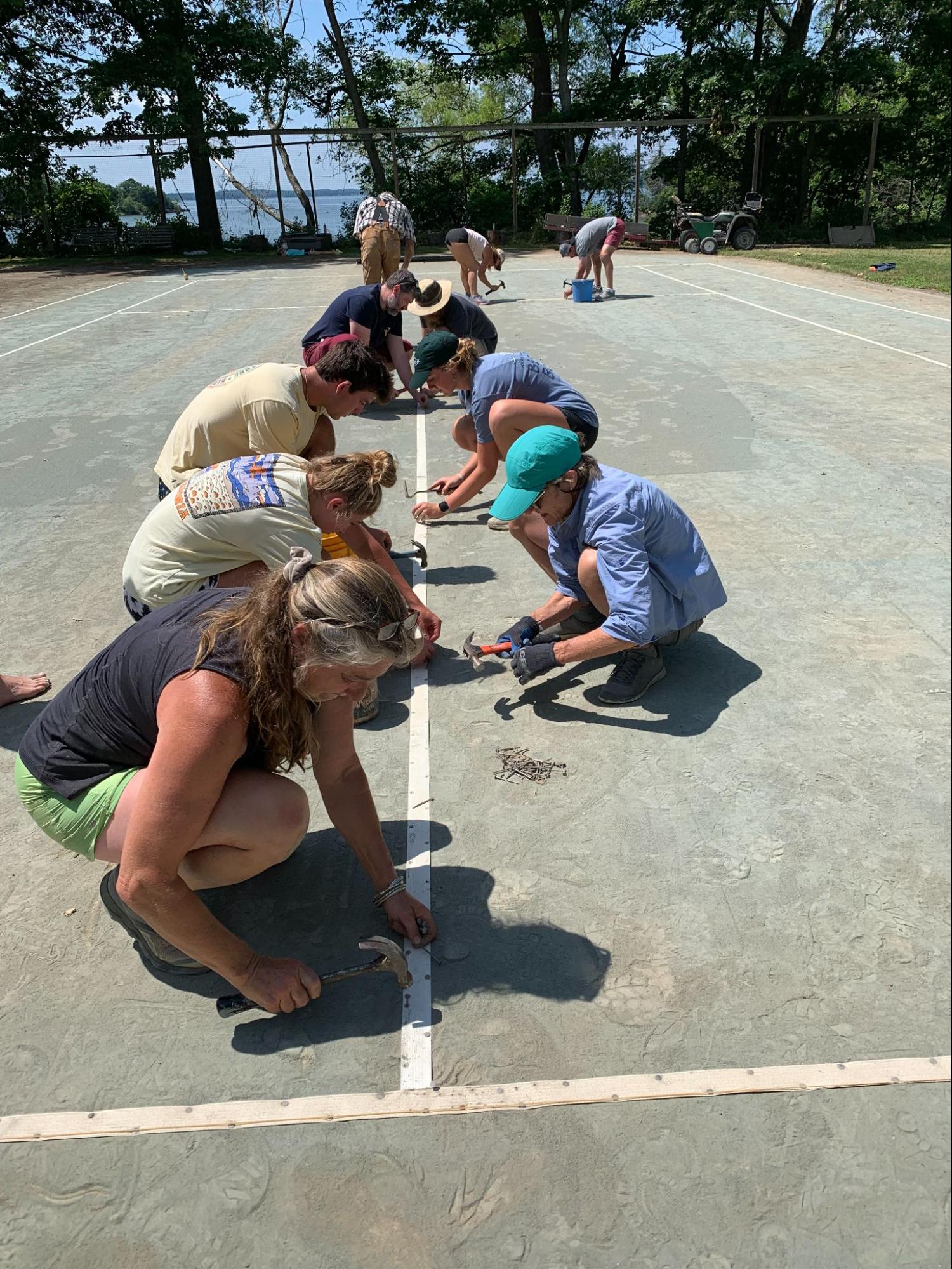 Lindley Bay members setting up the courts